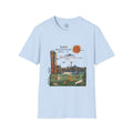 4 Paws Society light blue 100% cotton t-shirt with Seattle cityscape and dogs graphic, featuring Space Needle and text 'Seattle: Where the Forecast is 90% Chance of Dog.'